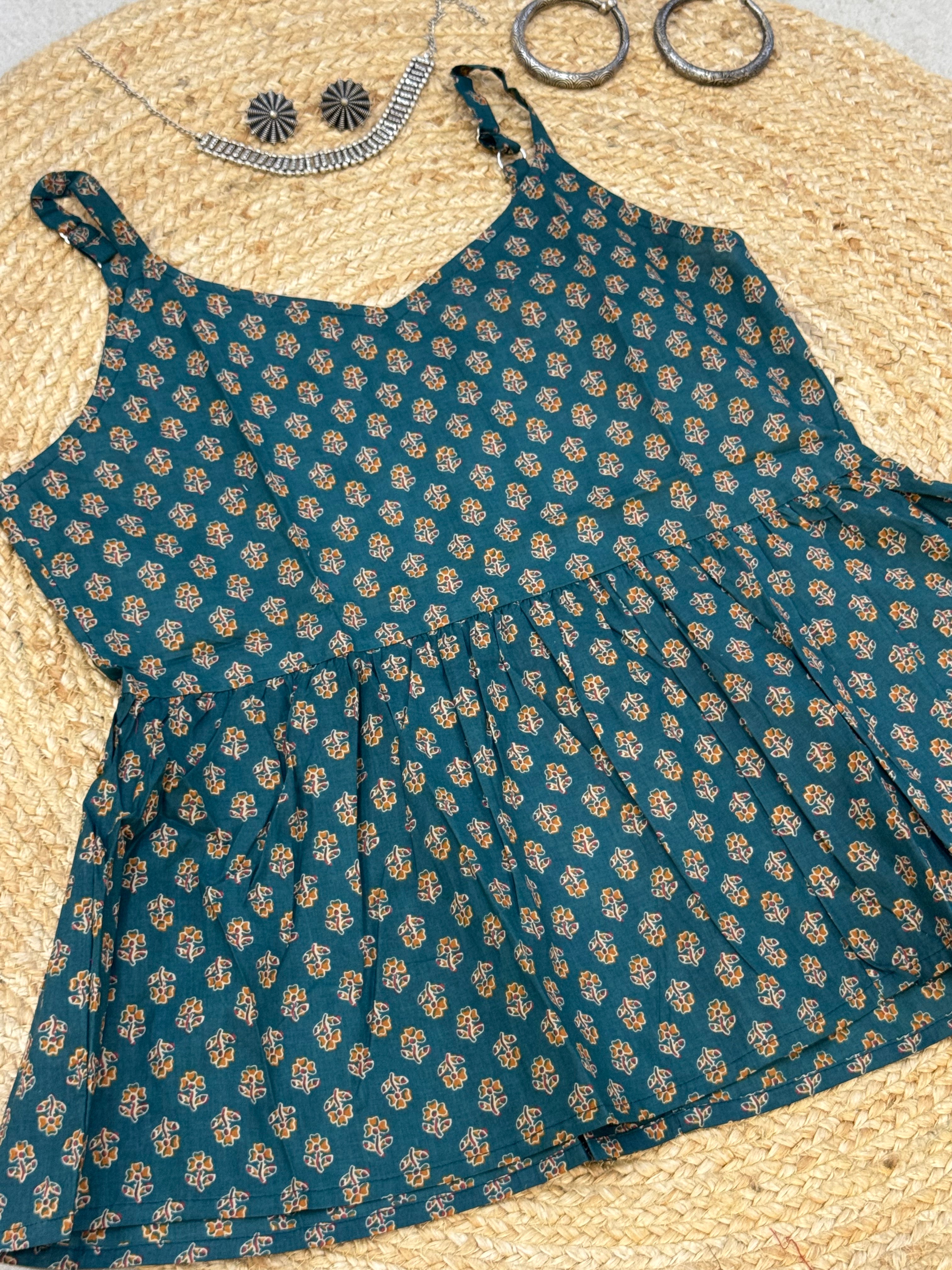 SLEEVELESS PEPLUM STYLE COTTON TOP