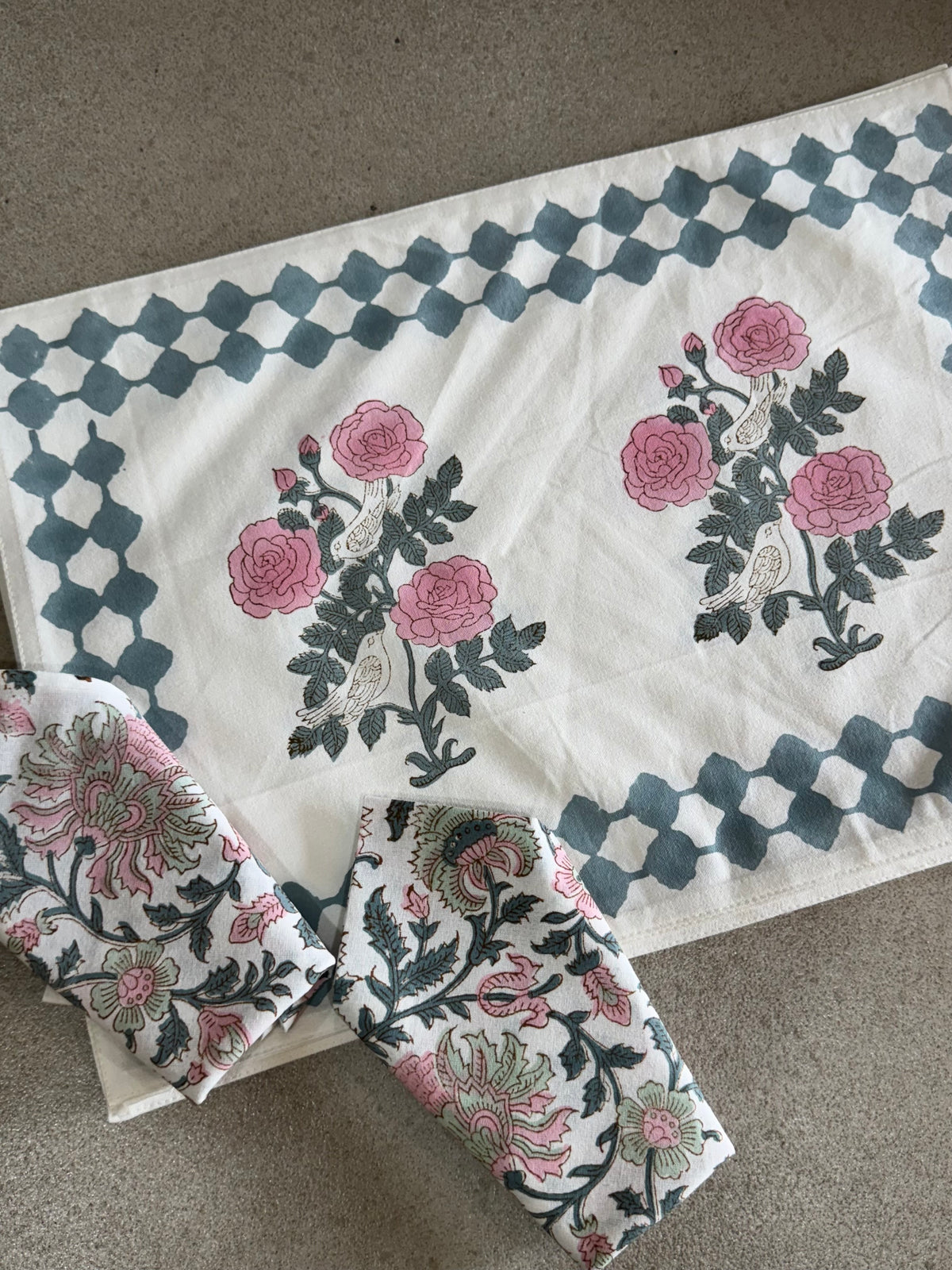 A PAIR OF HANDBLOCK PRINTED TABLE MAT AND NAPKIN SET