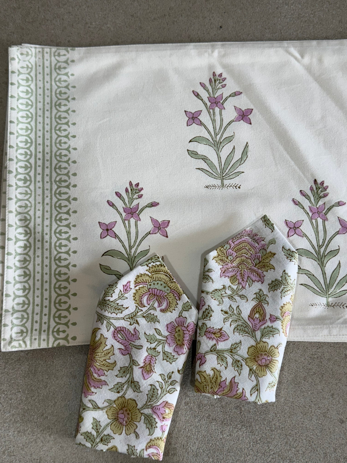A PAIR OF HANDBLOCK PRINTED TABLE MAT AND NAPKIN SET