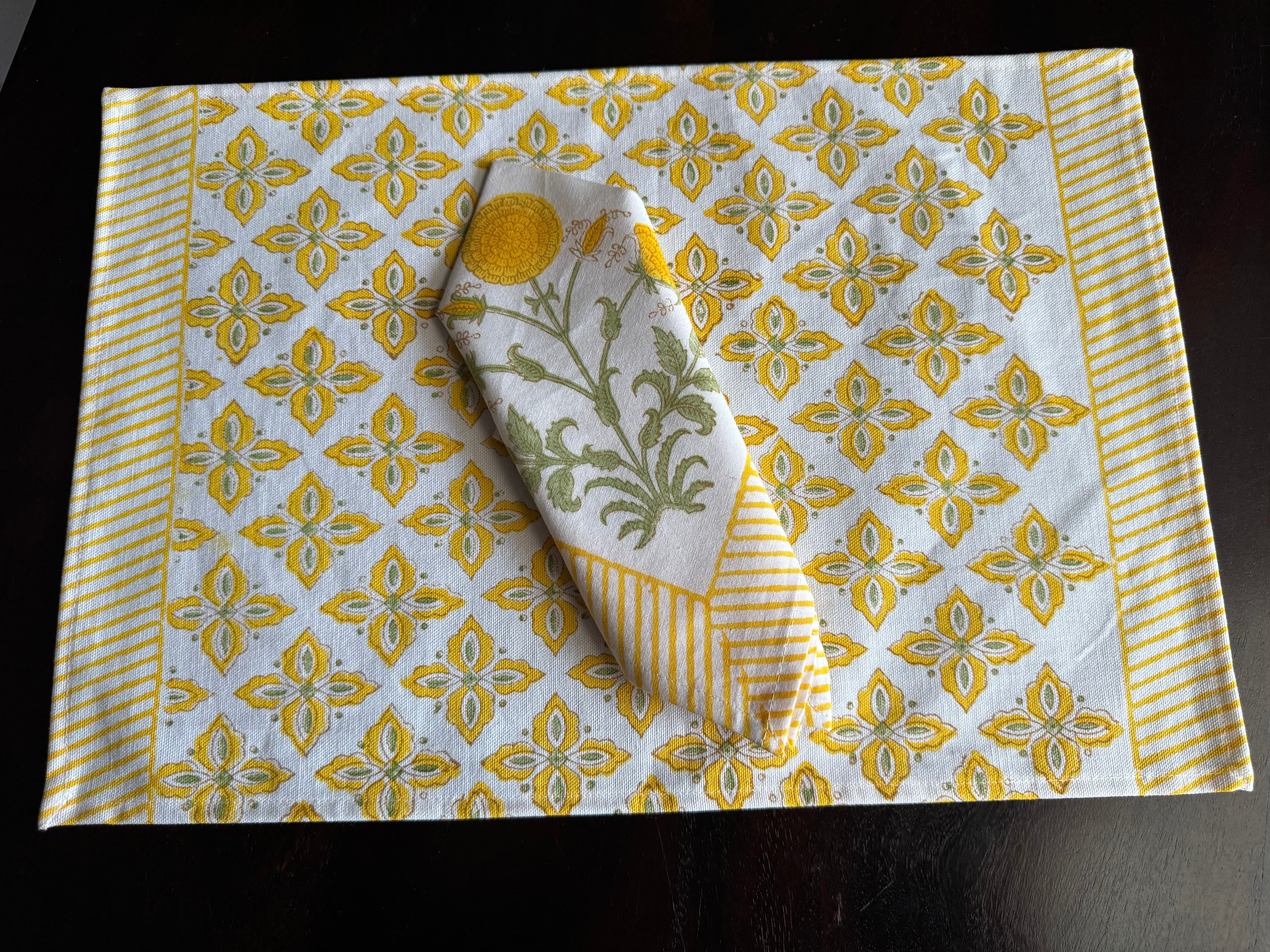 A PAIR OF HANDBLOCK PRINTED TABLE MAT AND NAPKIN SET
