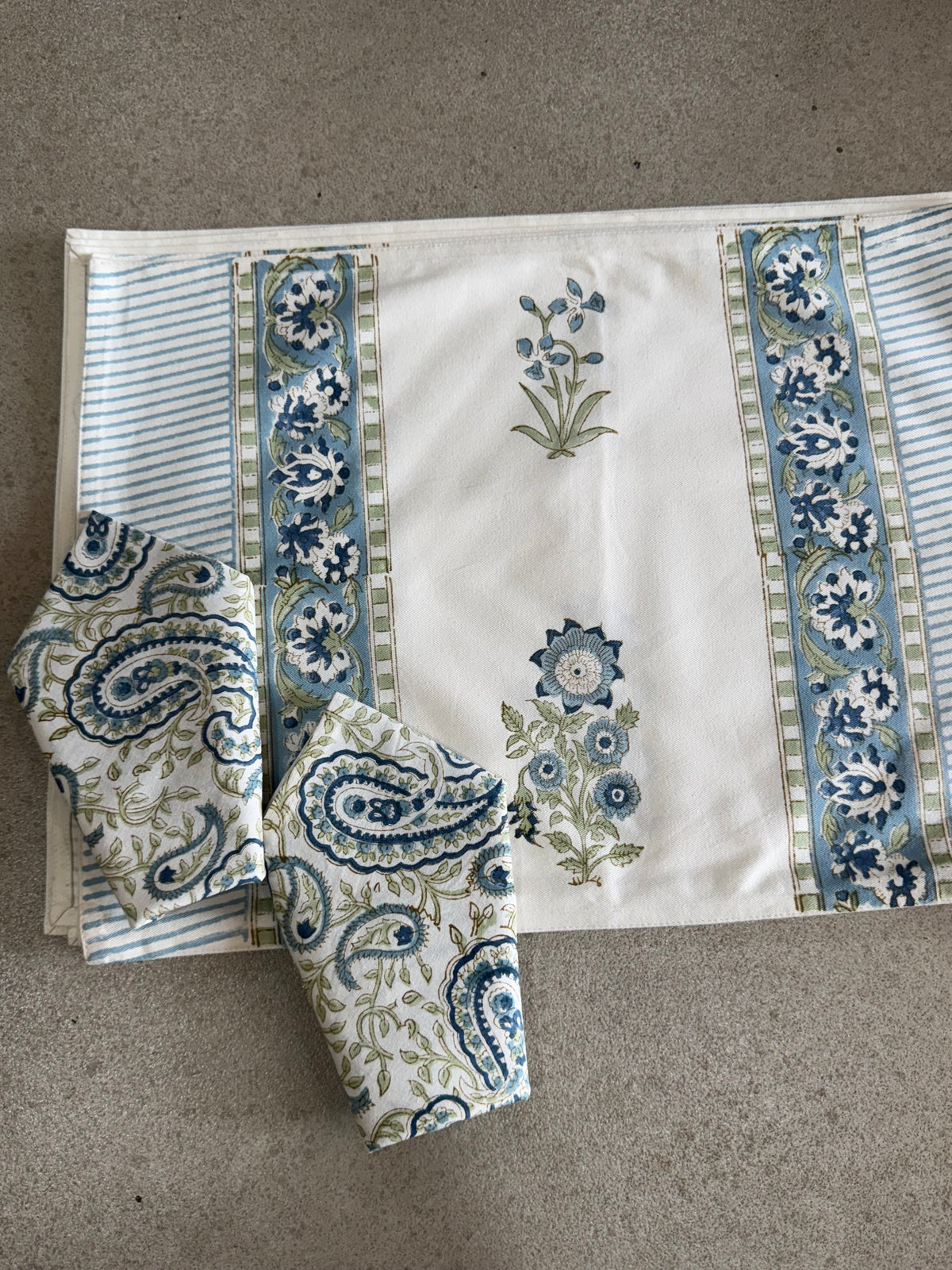 A PAIR OF HANDBLOCK PRINTED TABLE MAT AND NAPKIN SET
