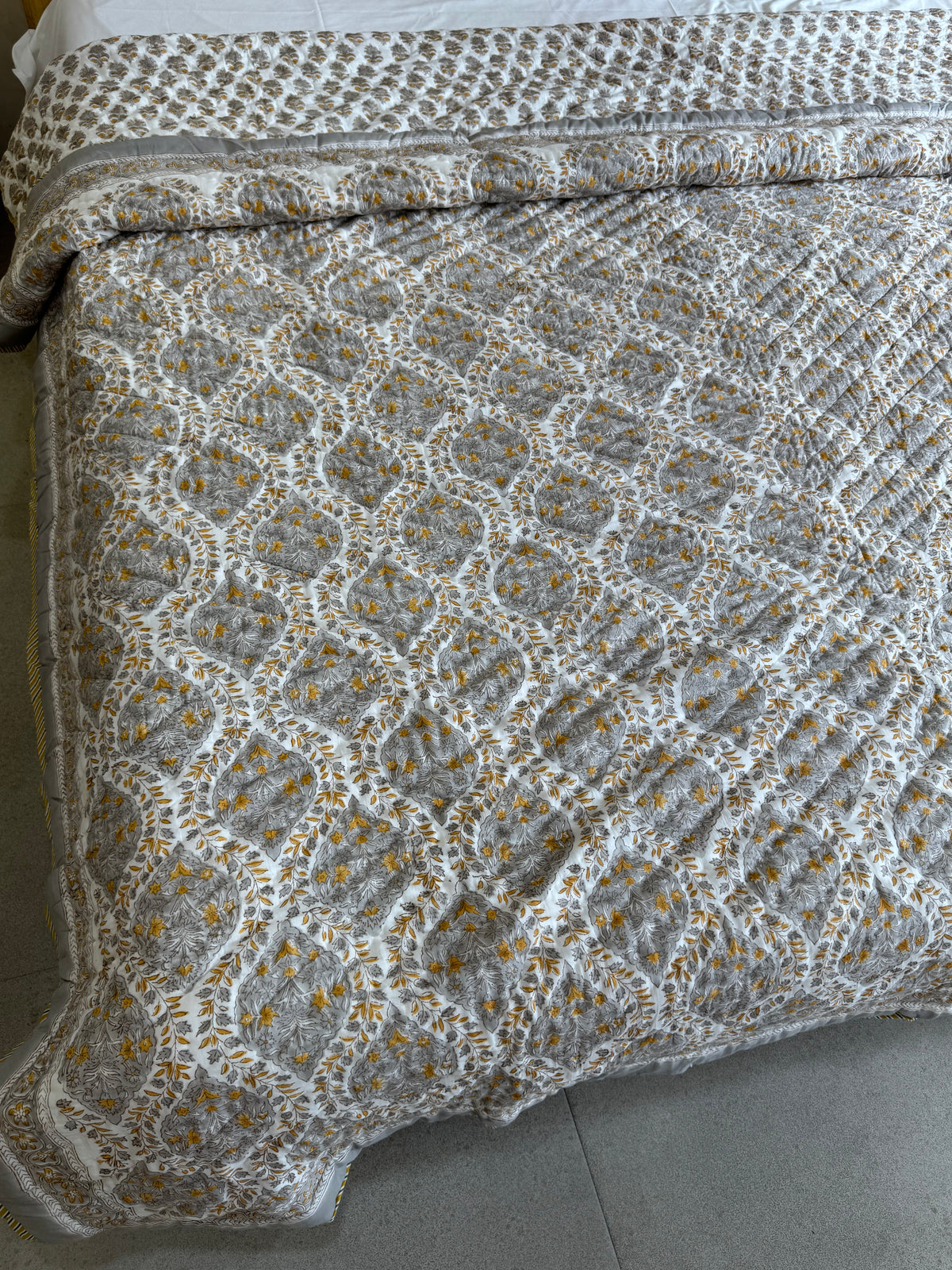 FESTIVE HAND BLOCK PRINTED REVERSIBLE QUILT (DOUBLE BED)