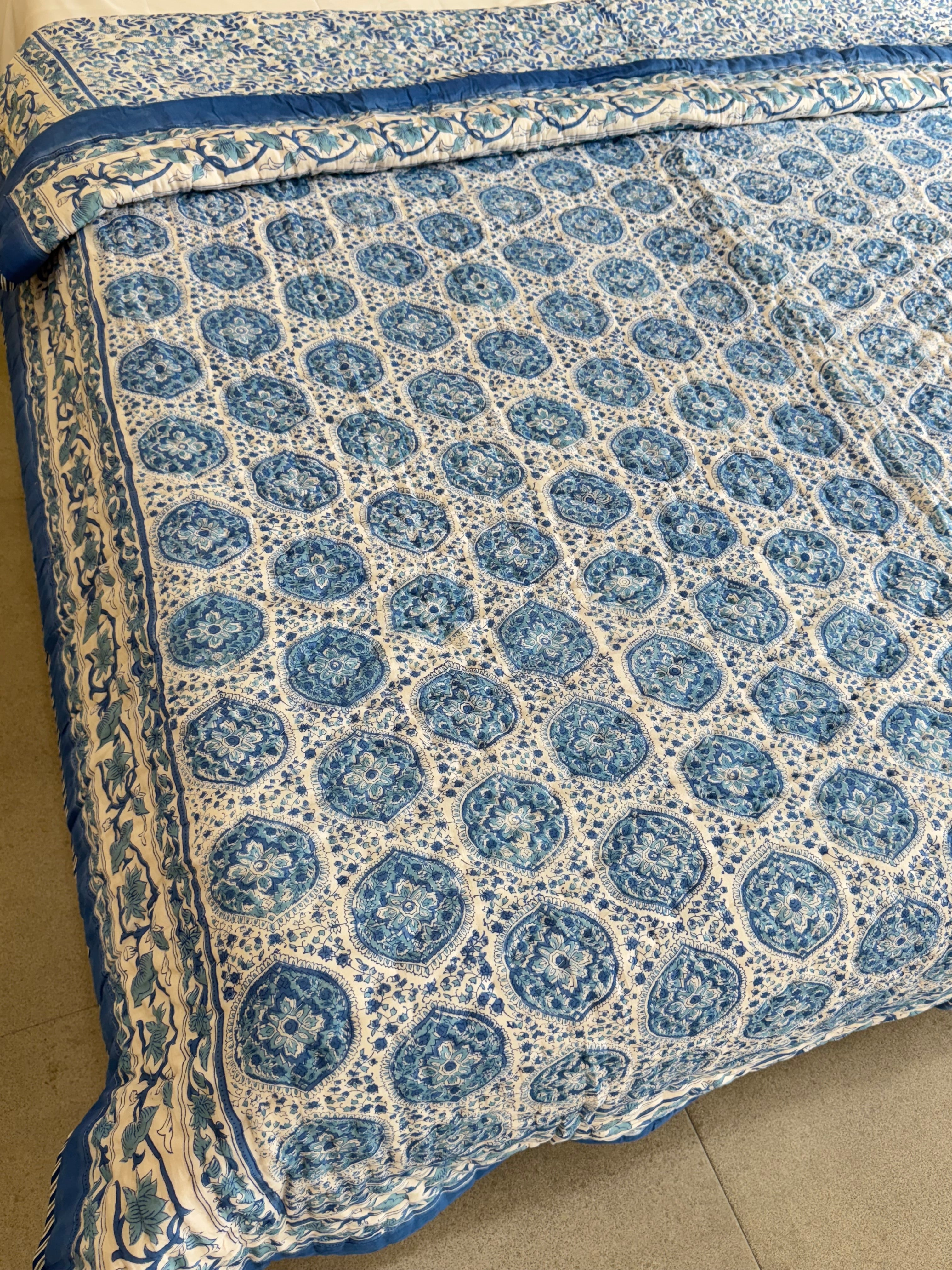 FESTIVE HAND BLOCK PRINTED REVERSIBLE QUILT (DOUBLE BED)