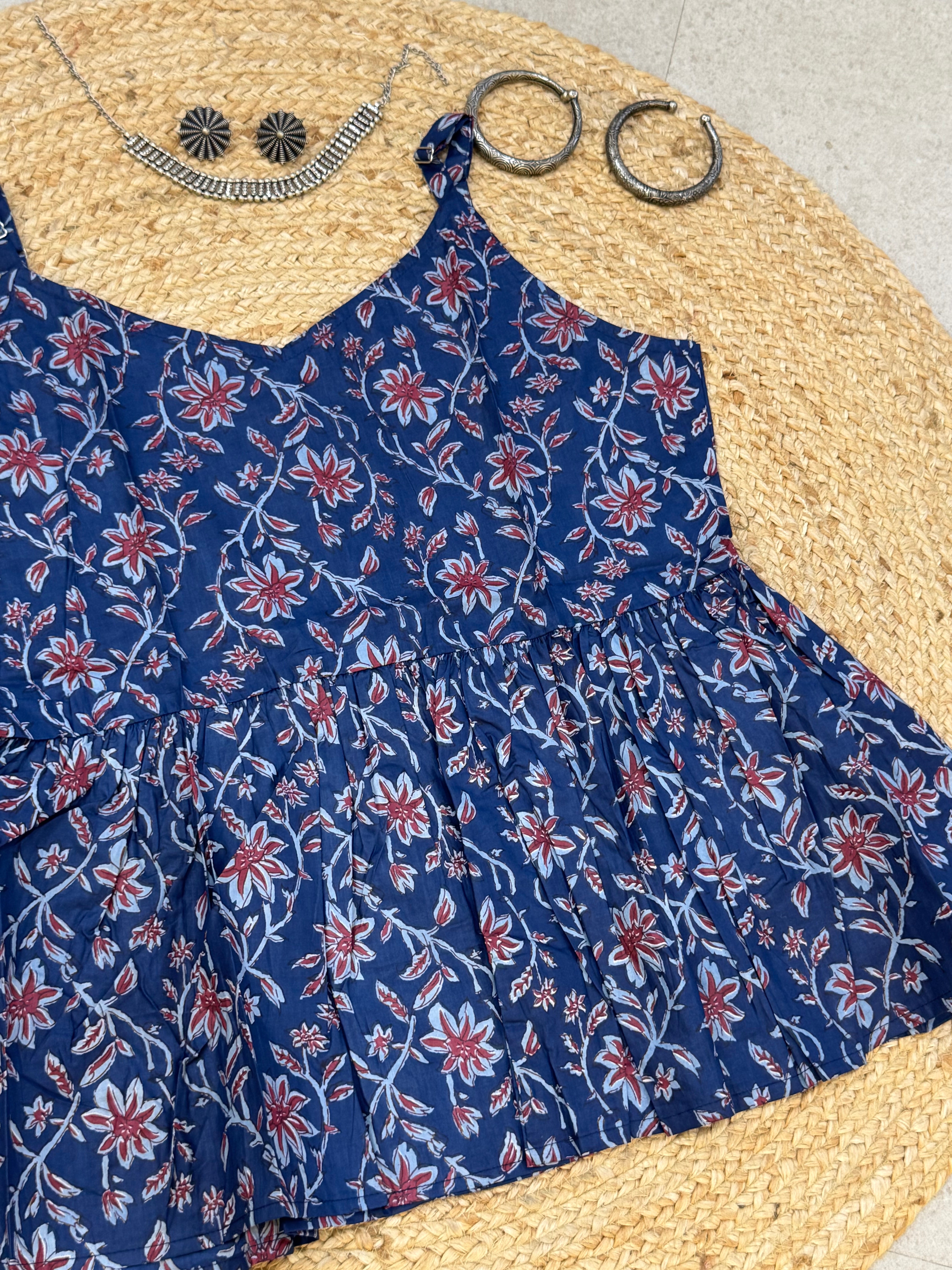 SLEEVELESS PEPLUM STYLE COTTON TOP