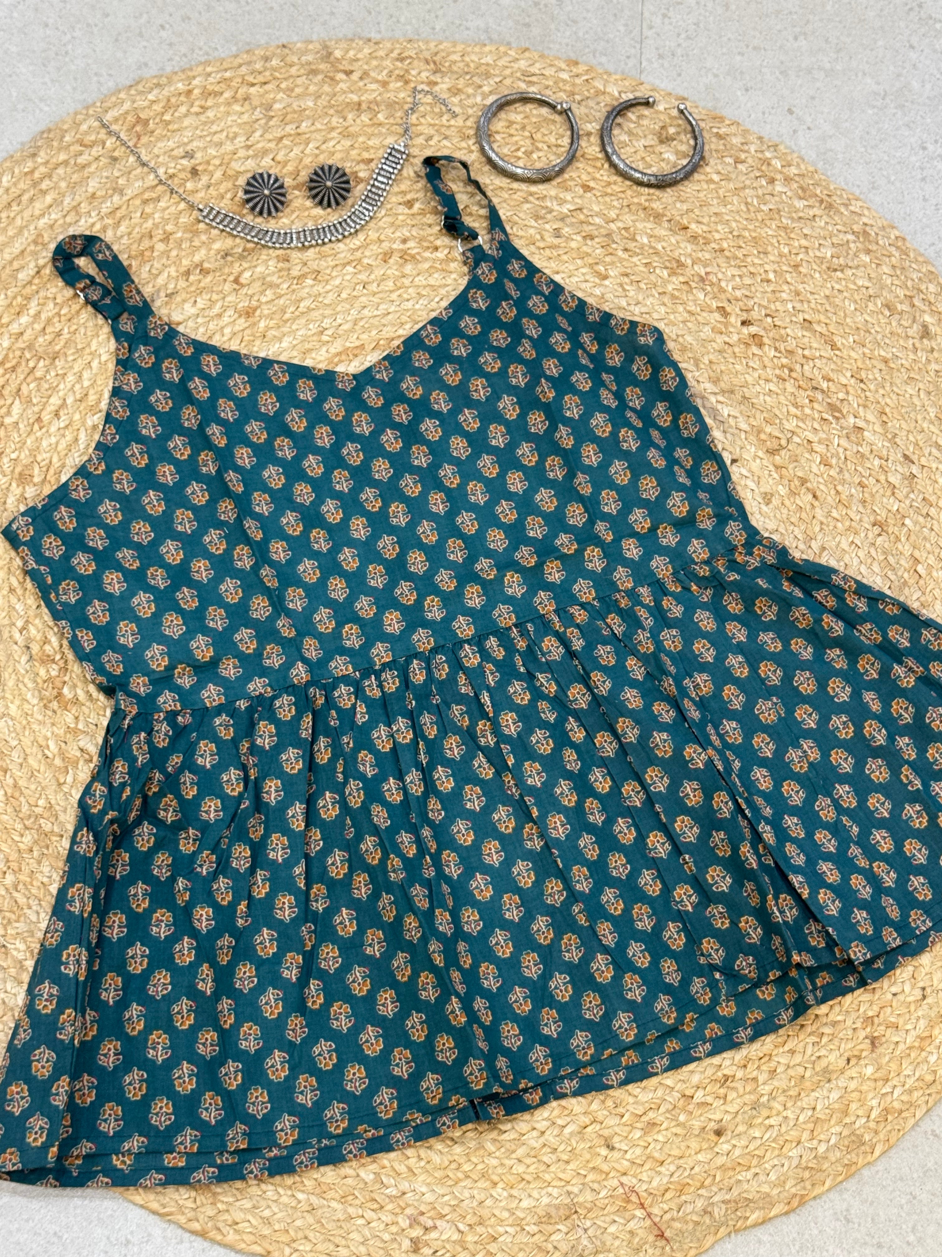 SLEEVELESS PEPLUM STYLE COTTON TOP