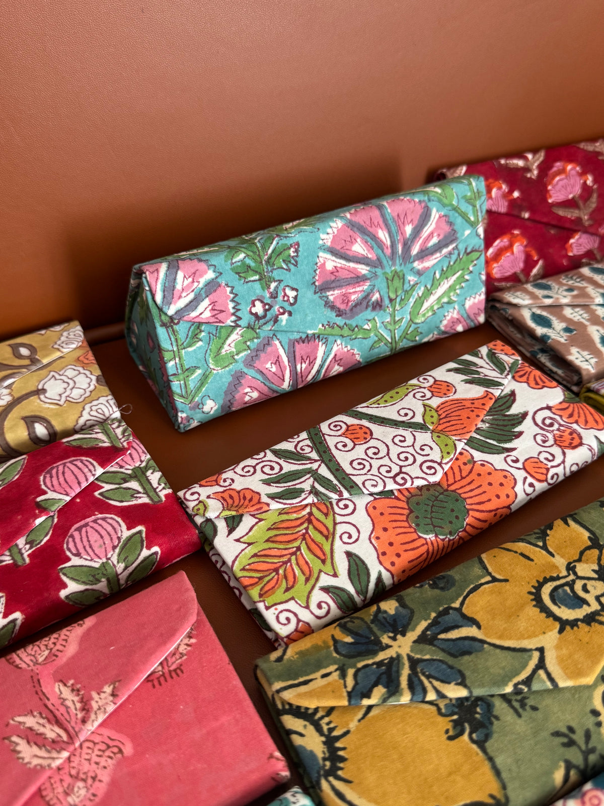 A PAIR OF COLLAPSIBLE BLOCK PRINTED SUNGLASSES COVER