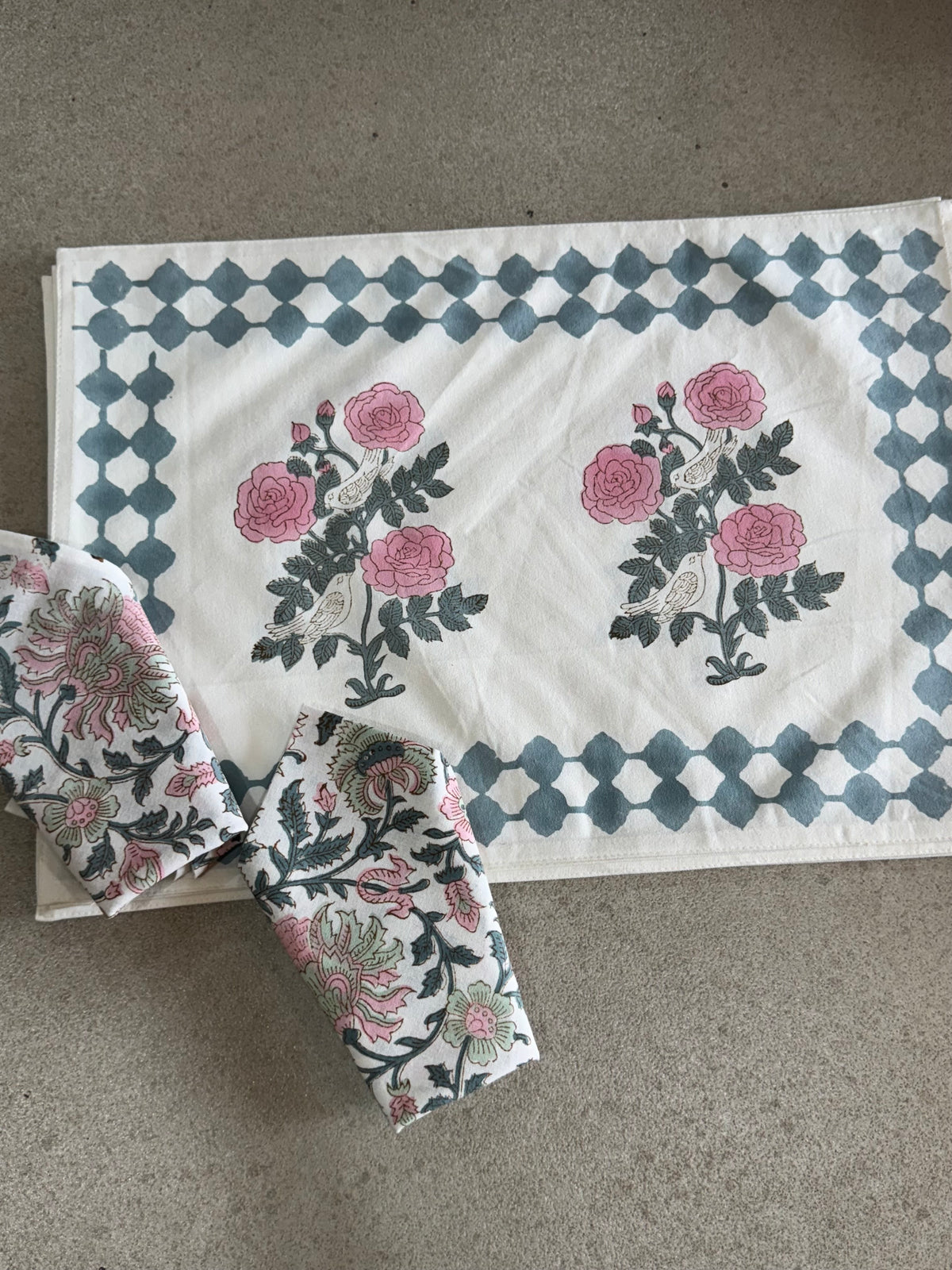 A PAIR OF HANDBLOCK PRINTED TABLE MAT AND NAPKIN SET