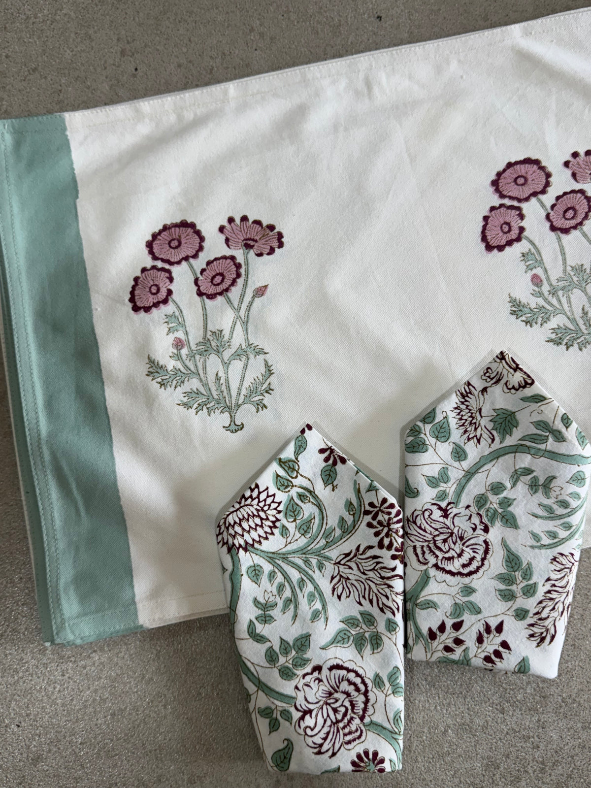 A PAIR OF HANDBLOCK PRINTED TABLE MAT AND NAPKIN SET