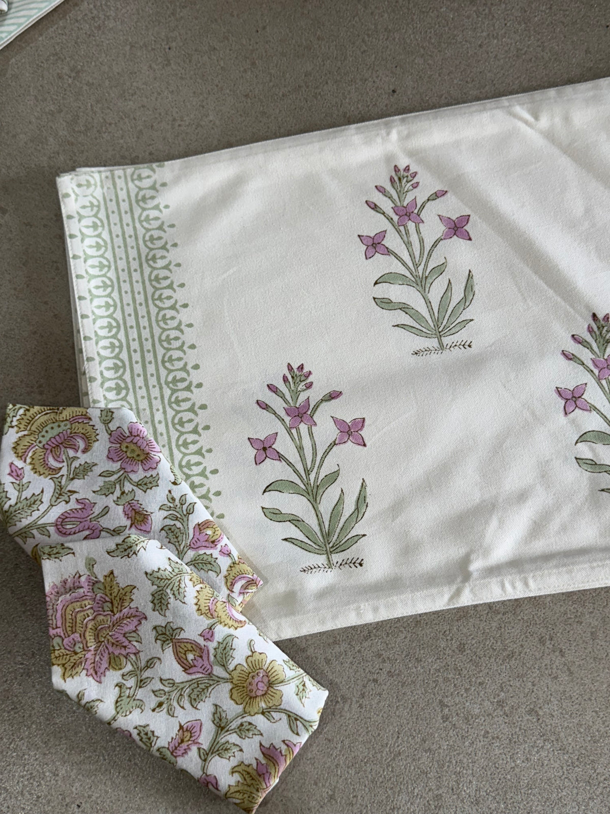 A PAIR OF HANDBLOCK PRINTED TABLE MAT AND NAPKIN SET