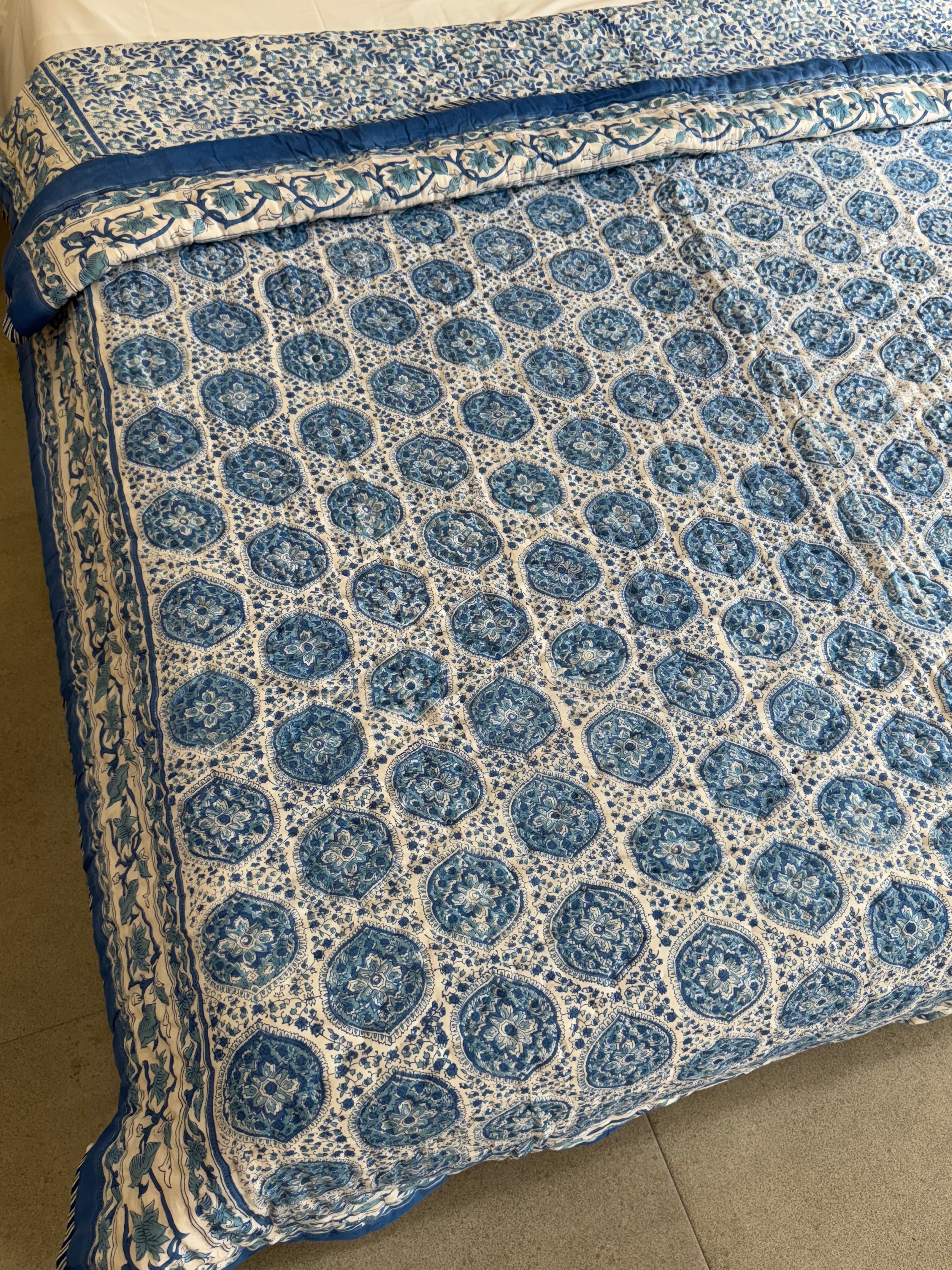 FESTIVE HAND BLOCK PRINTED REVERSIBLE QUILT (DOUBLE BED)