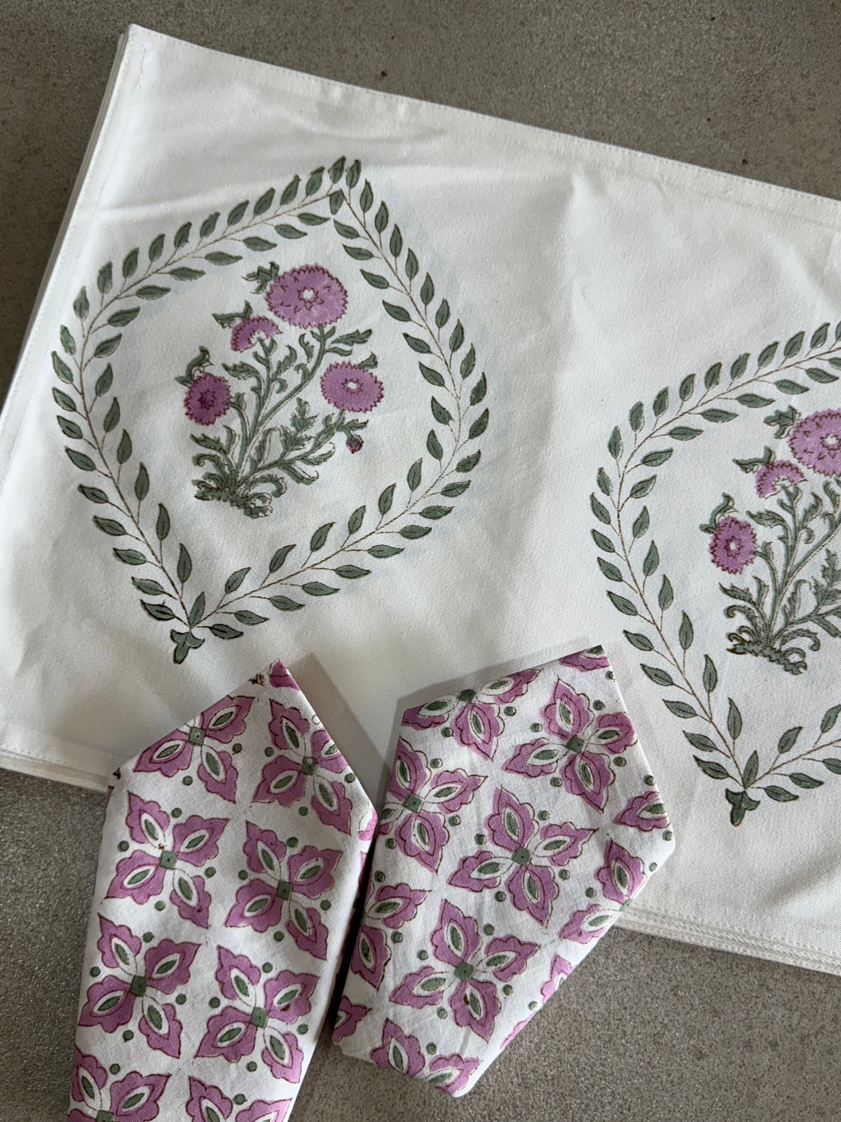 A PAIR OF HANDBLOCK PRINTED TABLE MAT AND NAPKIN SET