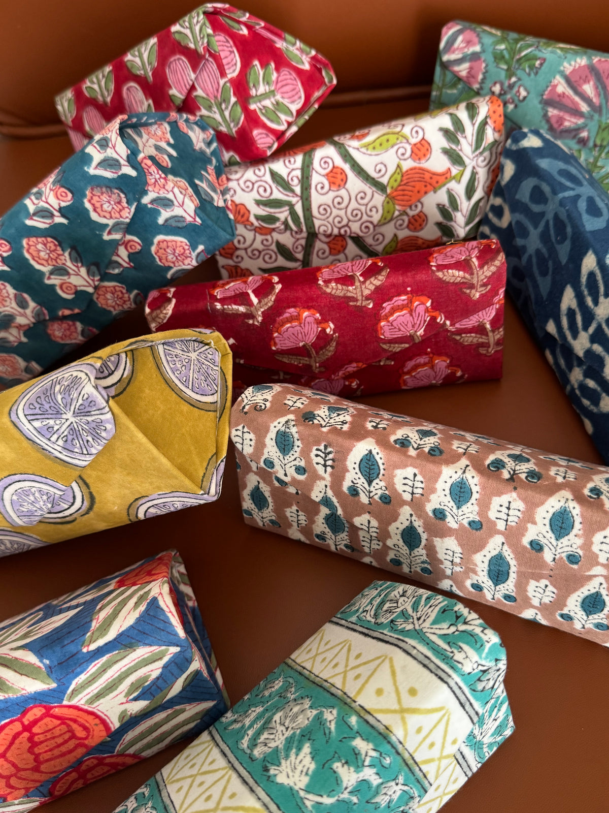 A PAIR OF COLLAPSIBLE BLOCK PRINTED SUNGLASSES COVER