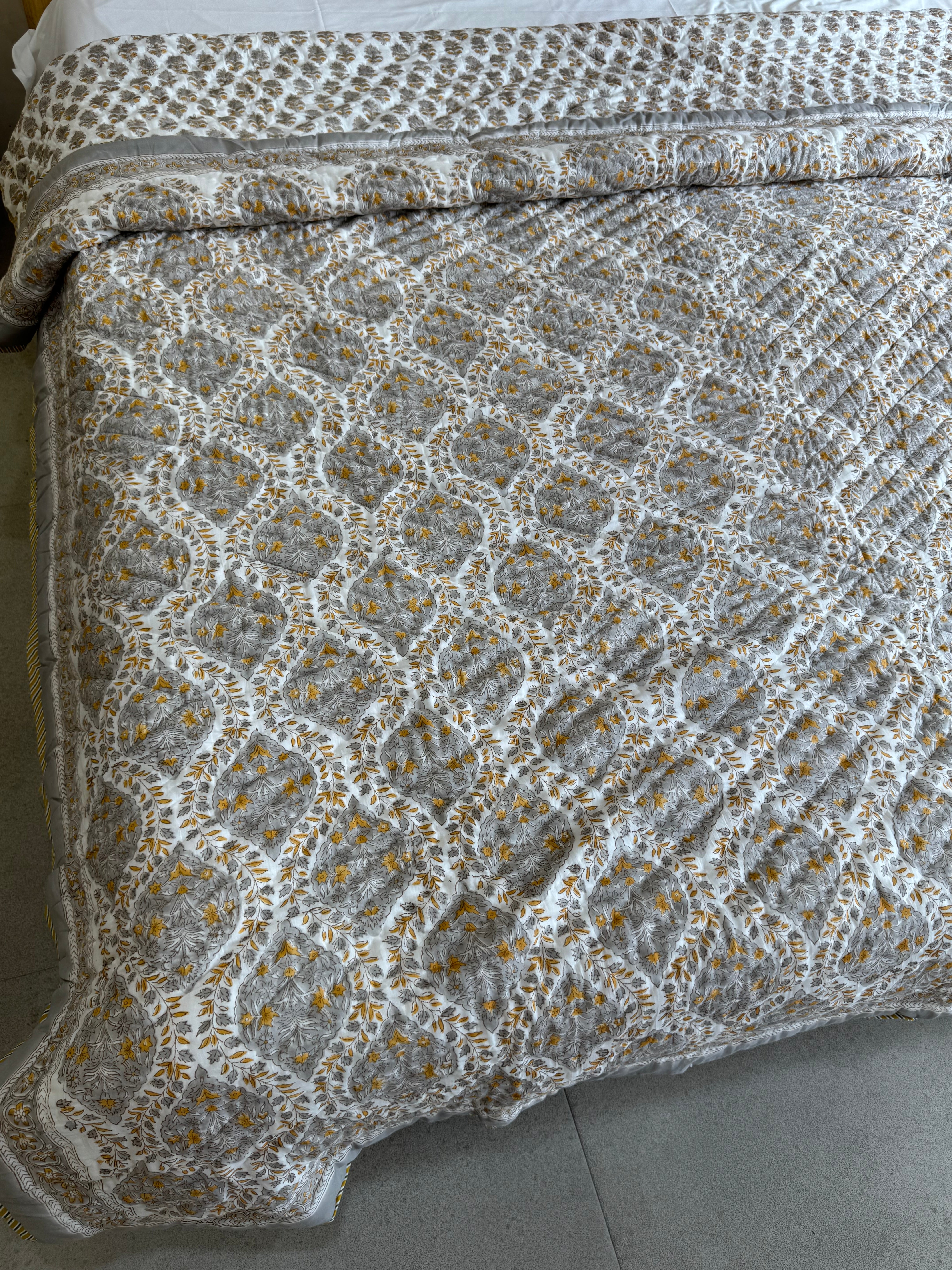 FESTIVE HAND BLOCK PRINTED REVERSIBLE QUILT (DOUBLE BED)