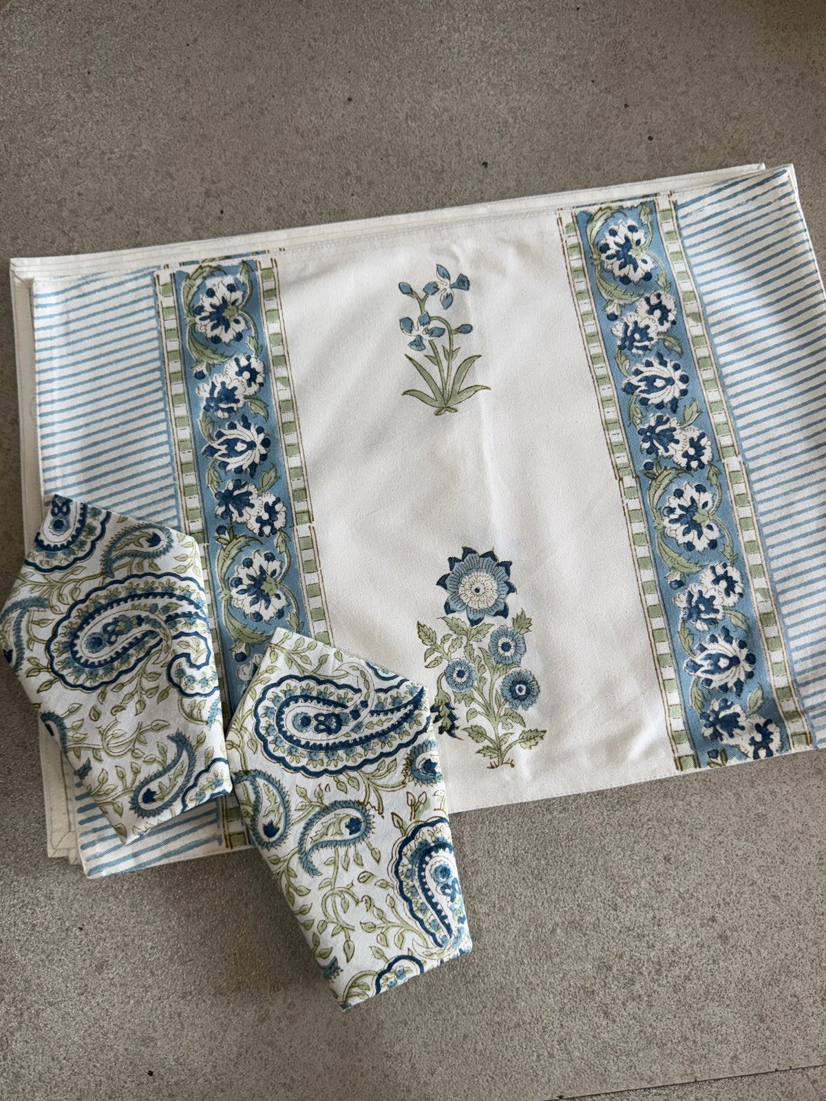 A PAIR OF HANDBLOCK PRINTED TABLE MAT AND NAPKIN SET