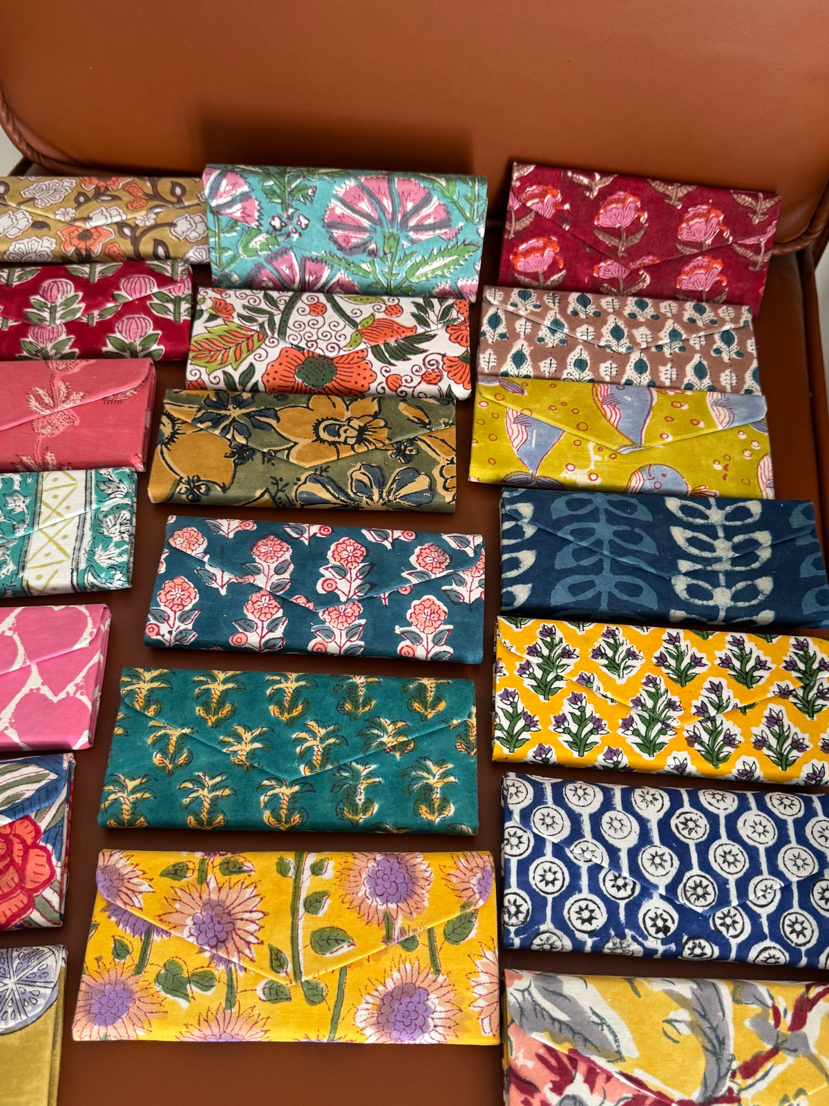 A PAIR OF COLLAPSIBLE BLOCK PRINTED SUNGLASSES COVER