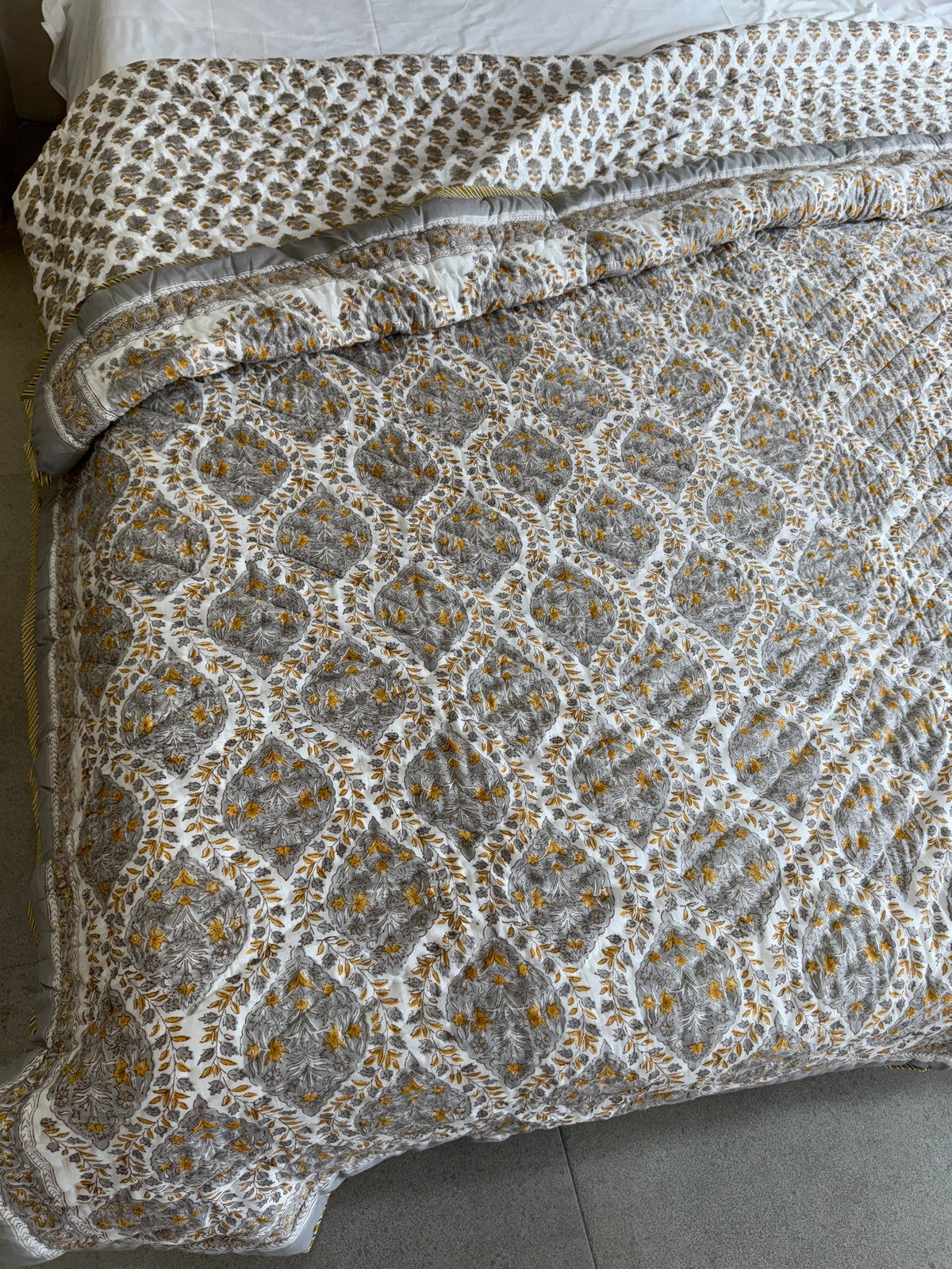 FESTIVE HAND BLOCK PRINTED REVERSIBLE QUILT (DOUBLE BED)