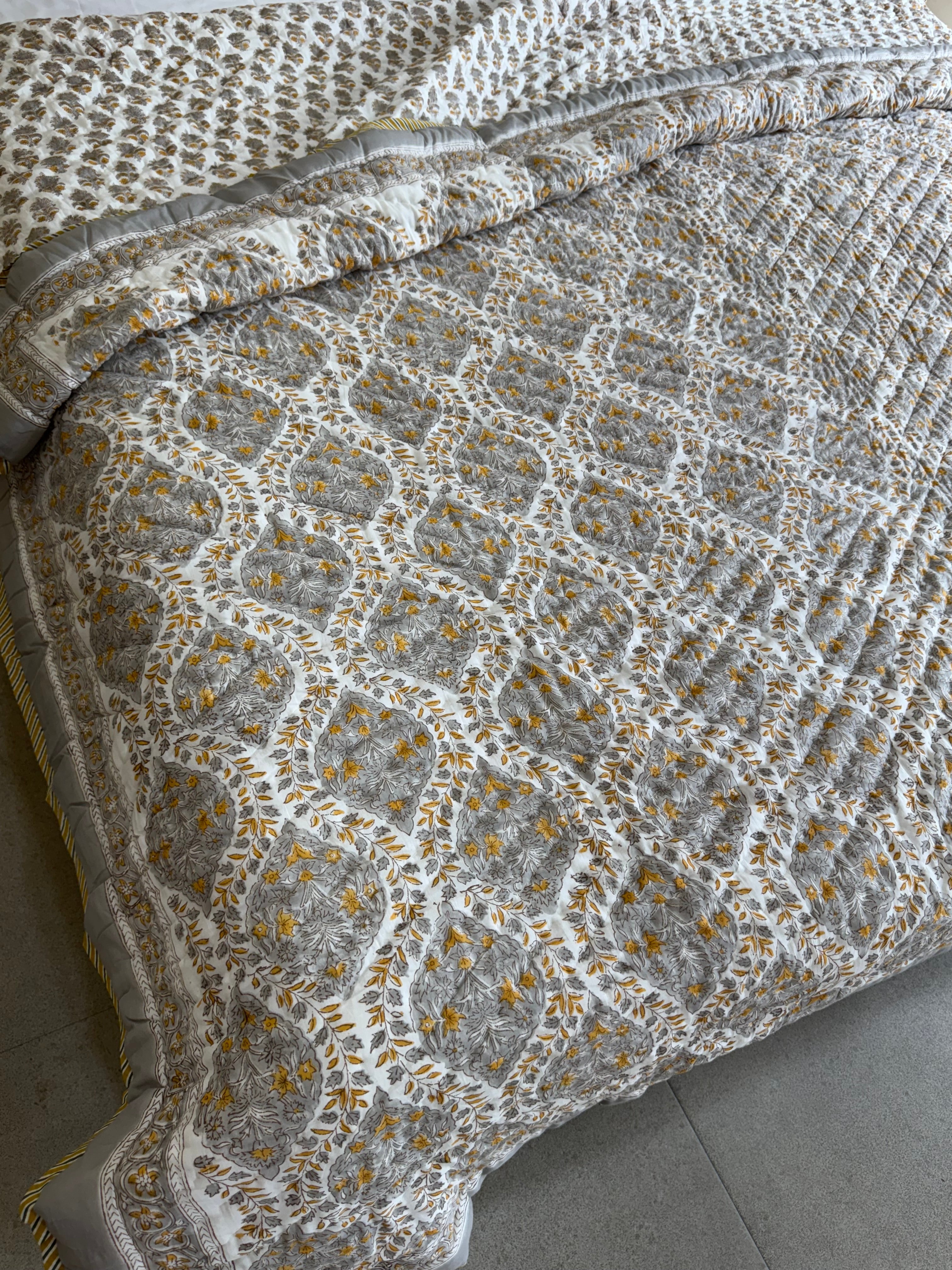 FESTIVE HAND BLOCK PRINTED REVERSIBLE QUILT (DOUBLE BED)