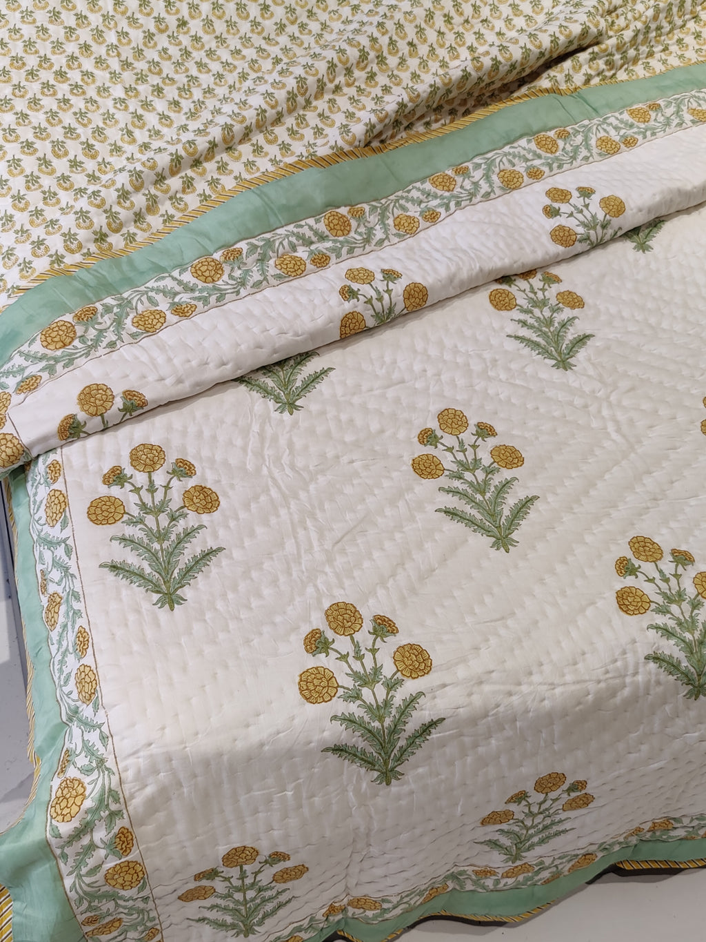 MARIGOLD WITH GREEN BORDER HAND BLOCK PRINTED REVERSIBLE MULMUL QUILT